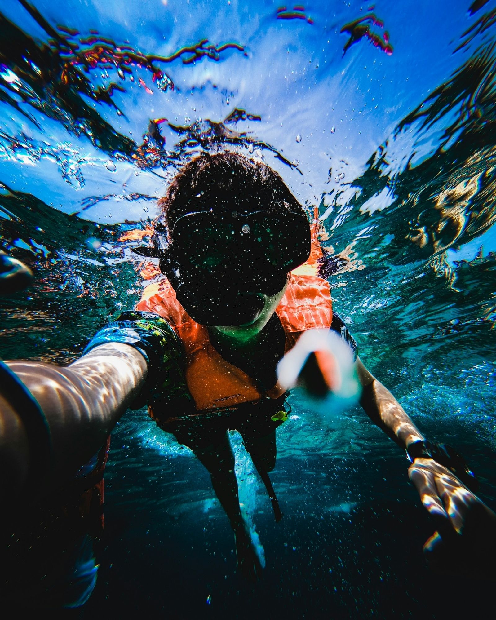Child Snorkeling With Life Jacket