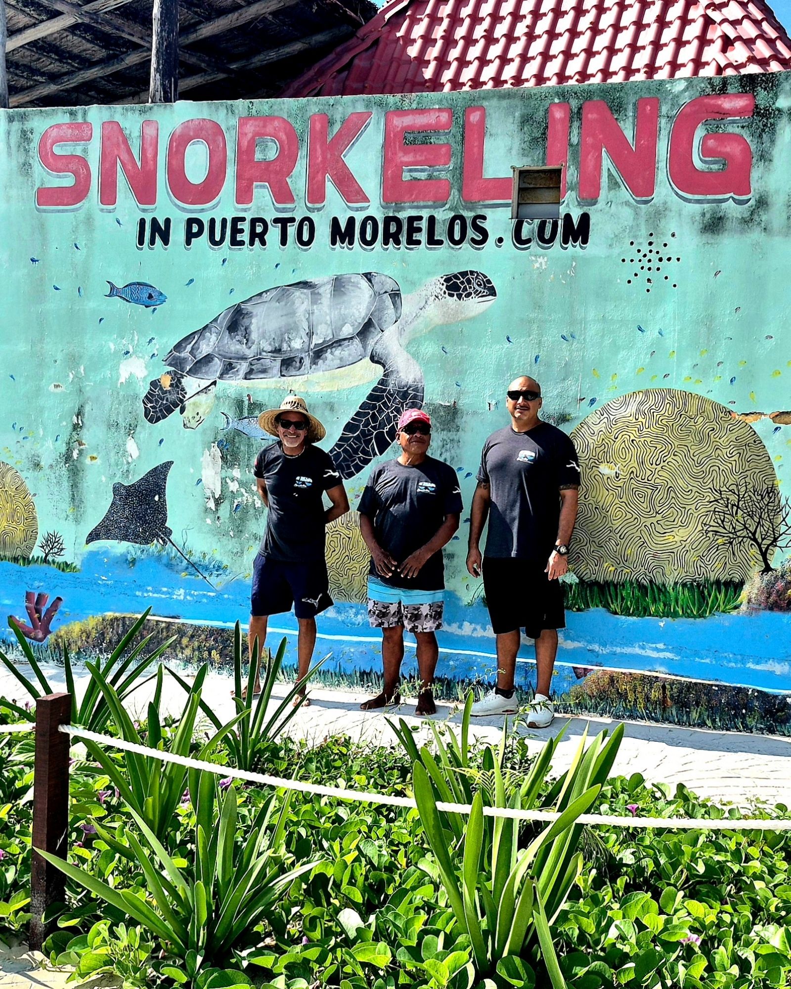 mario and the crew in front of mural