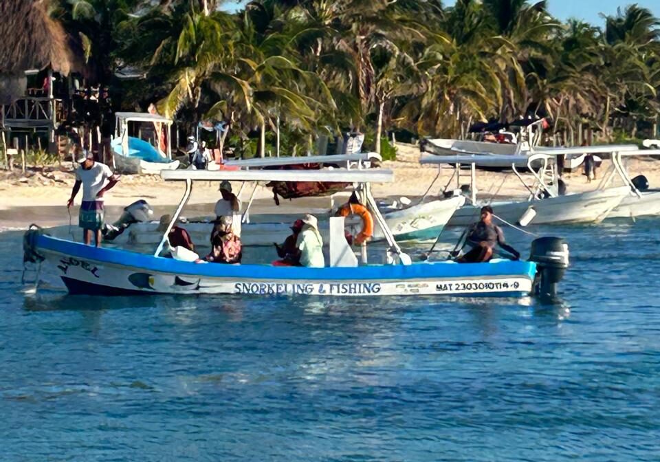 fishing tour leaving beach in puerto morelos
